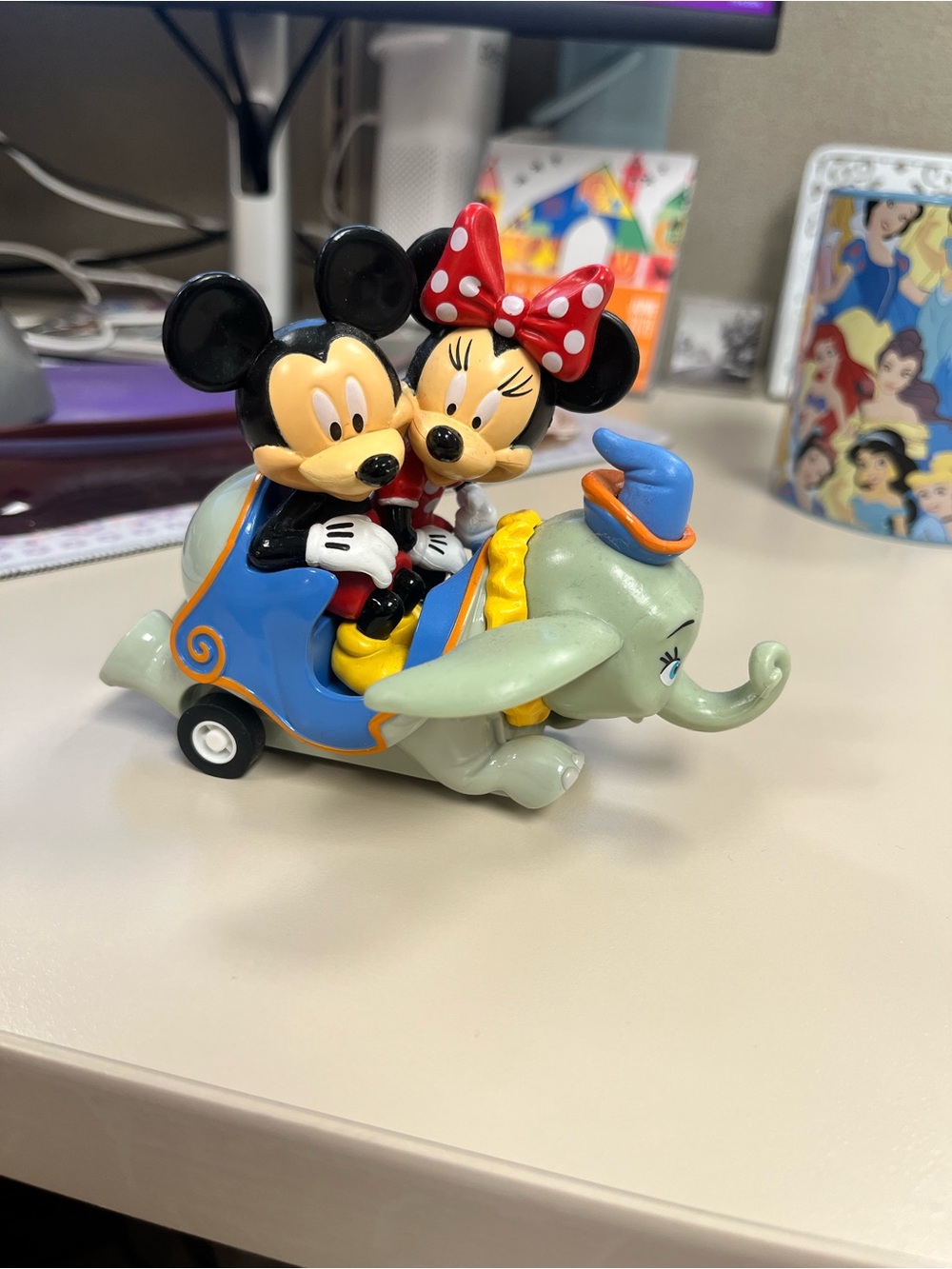 Disney Mickey and Minnie Mouse on Dumbo ride toy